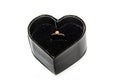 Beautiful shiny engagement ring with diamond in heart shape velvet box isolated on white background Valentine`s Day Royalty Free Stock Photo