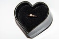 Beautiful shiny engagement ring with diamond in heart shape velvet box  on white background Valentine`s Day Royalty Free Stock Photo