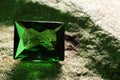Beautiful shiny green gemstone on stone, closeup. Space for text Royalty Free Stock Photo