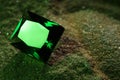 Beautiful shiny green gemstone on stone, closeup. Space for text Royalty Free Stock Photo