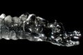 Unusual sparkling icicles on black background Royalty Free Stock Photo