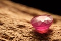 Beautiful shiny pink gemstone on stone, closeup. Space for text Royalty Free Stock Photo