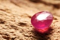 Beautiful shiny pink gemstone on stone, closeup. Space for text Royalty Free Stock Photo