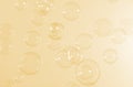 Beautiful shiny transparent soap bubbles float on yellow texture background. Abstract, Celebration, Natual fresh summer. Royalty Free Stock Photo