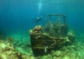 beautiful shipwreck and a diver in the crystal clear waters of the island of Curacao