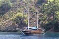 Beautiful shoot of wooden sailing yacht near shore at morning time