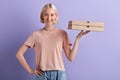 Beautiful shop assistant offers pizza to customers Royalty Free Stock Photo