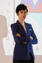 Beautiful short hair businesswoman standing in the light of projector machine during make a presentation in meeting Royalty Free Stock Photo