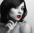 Beautiful short hair style woman with red lips looking sexy. Black and white contrast closeup portrait