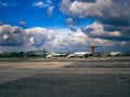 Beautiful shot of an airport runway with a white airplane