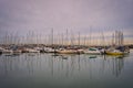 Beautiful shot of anchored sailboats in the harbor with reflections on the water Royalty Free Stock Photo