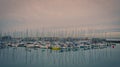 Beautiful shot of anchored sailboats in the harbor with reflections on the water Royalty Free Stock Photo