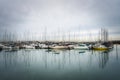 Beautiful shot of anchored sailboats in the harbor with reflections on the water Royalty Free Stock Photo