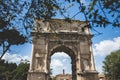 Beautiful shot of the Arch of Titus Rome in Italy on a blue sky background