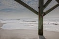 Beautiful shot of Atlantic ocean viewed from under a fishing pier in Myrle Beach in California