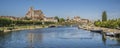 Beautiful shot of the Auxerre Cathedral near the Yonne river on a sunny afternoon in France