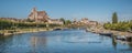 Beautiful shot of the Auxerre Cathedral near the Yonne river on a sunny afternoon in France