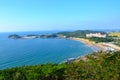 Beautiful shot of the beach and a white building on the hill in Byeonsan-Bando National Park