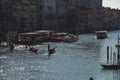 Beautiful shot of boats on the canal in the middle of buildings in Venice Italy