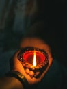 A beautiful shot of the bride and groom's hands holding a candle. Royalty Free Stock Photo