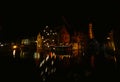 Beautiful shot of buildings with lit lights near the water at night time Royalty Free Stock Photo