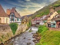 Beautiful shot of buildings and a river in Kaysersberg, France Royalty Free Stock Photo