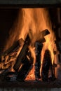 Beautiful shot of burning wood logs creating amazing orange flames Royalty Free Stock Photo
