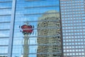 Beautiful shot of the Calgary Tower reflection seen in the glass skyscraper