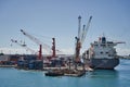 Beautiful shot of cargo freight containers and cranes in the Tahiti port of Papeete in France