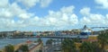 Beautiful shot of a coastal city with a huge cruise ship parked in the harbor Royalty Free Stock Photo