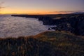 Beautiful shot of coastal cliffs at sunset Royalty Free Stock Photo