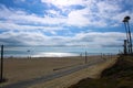 a beautiful shot of the coastline at the beach with lush green palm trees and blue sky with majestic clouds Royalty Free Stock Photo