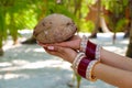 Coconut in a women's hand.