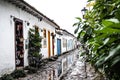 Beautiful shot of the Colonial Street in Paraty, Brazil with trees on the foreground