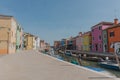 Beautiful shot of colorful houses and a canal in Burano island on a sunny day near Venice, Italy Royalty Free Stock Photo