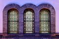 Beautiful shot of a colorful stained glass window of a synagogue in Serbia in the evening