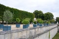 Beautiful shot of a designed park with nicely cut trees and wide waling paths