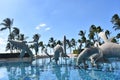 Beautiful shot of dolphin statues in the middle of a water fountain in a park Royalty Free Stock Photo