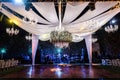 Beautiful shot of an elegant outdoor wedding reception at night