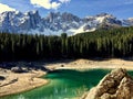 Beautiful shot of the emeraldCarezza lake and Latemar mountains in the Dolomites, Italy