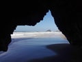 Beautiful shot of the empty calm shore through a cave hole, Ericeira, Portugal
