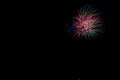 Beautiful shot of exploding colorful fireworks on a black night sky background Royalty Free Stock Photo