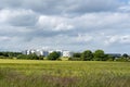 Beautiful shot of a field with the background of The Northumbria Specialist Emergency Care Hospital