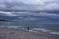 Beautiful shot of a fisherman on a beach on a cloudy sky background Royalty Free Stock Photo