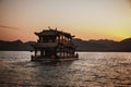 Beautiful shot of a floating antique ferry at sunset