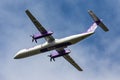 Beautiful shot of Flybe De Havilland Canada Dash airplane against a sky background