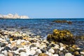 Beautiful shot of Giovinazzo beach in Apulia, Italy with a clear blue sky in the background