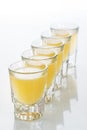 Beautiful shot glasses back lit. yellow Royalty Free Stock Photo