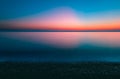 Beautiful shot of a glowing bright colorful sunset sky over the water in Lemnos, Greece Royalty Free Stock Photo