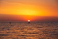 Beautiful shot of a glowing bright orange sunset sky over a sea Royalty Free Stock Photo